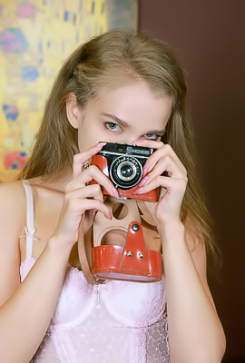 Xenia Glancing Back Over Her Shoulder With A Flirtatious Smile