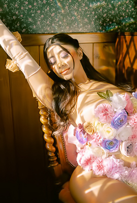 Violet Myers in floral lingerie posing solo by piano with white gloves and high heels