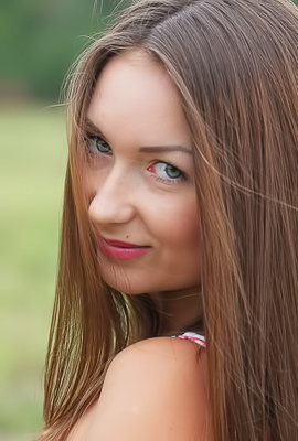 Alexa Day starts demure in a floral dress then goes topless and nude posing in the grass field